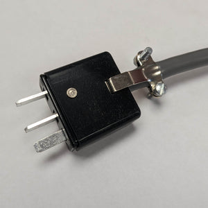 A black foot pedal with a rectangular plug designed for Fischer Epilator models TS-1, CB-X, and SE-5. The pedal measures 2.5” x 3.5” and includes a 7-foot cord for flexibility in electrolysis treatments.