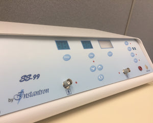 Instantronics SS-99 base model electrolysis machine featuring a sleek design, with digital and analog meters for precise control. The unit includes membrane switches, a tone signal for skin contact, and an optional footswitch for operation. Compact and professional-grade, for thermolysis treatments.