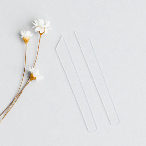 "RefectoCil Silicone Lash Ribbons for precise and reusable lash lifts, available from A & E Beauty Supplies.Two ribbons with a few flowers on a clean white background"