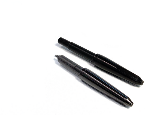 A black needle tip designed for use with Silhouet-Tone needle holders or probe holders. The tip is compatible with Evo 7, Evo X, ST250, and ST350 electrolysis machines, providing precision for hair removal treatments.