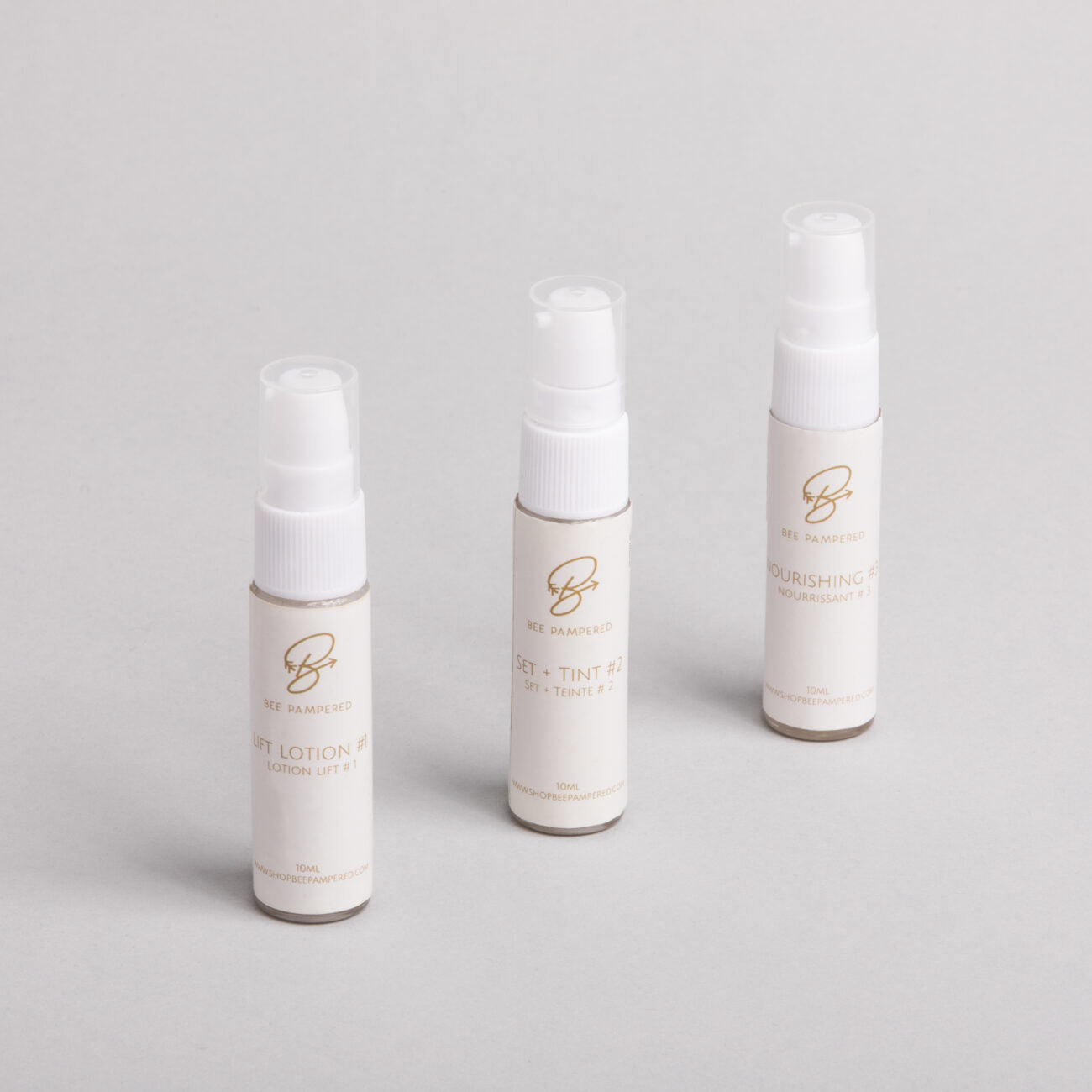 'Bee pampered, Refill packs of lifting lotion designed for professional brow lamination and lash lift treatments, displayed in sleek, professional packaging on a clean, neutral background."