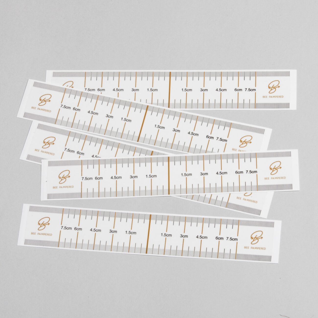 "Eyebrow Guides (10 pack) - A & E Beauty Supplies. paper with measuring marks on them"