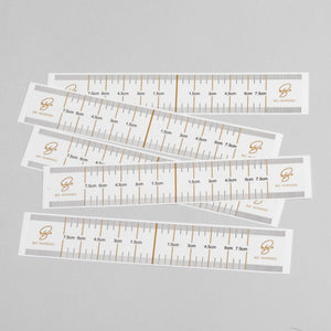 "Eyebrow Guides (10 pack) - A & E Beauty Supplies. paper with measuring marks on them"