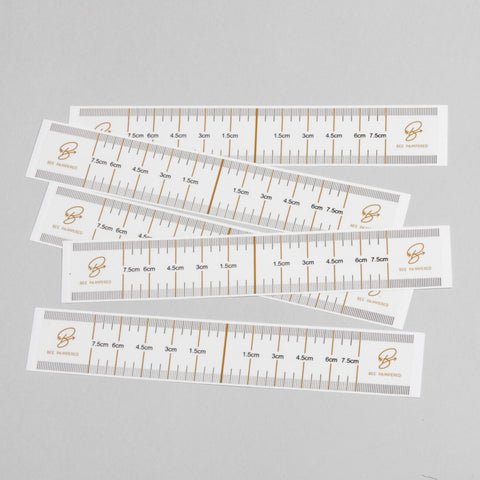 "Eyebrow Guides (10 pack) - A & E Beauty Supplies. paper with measuring marks on them"