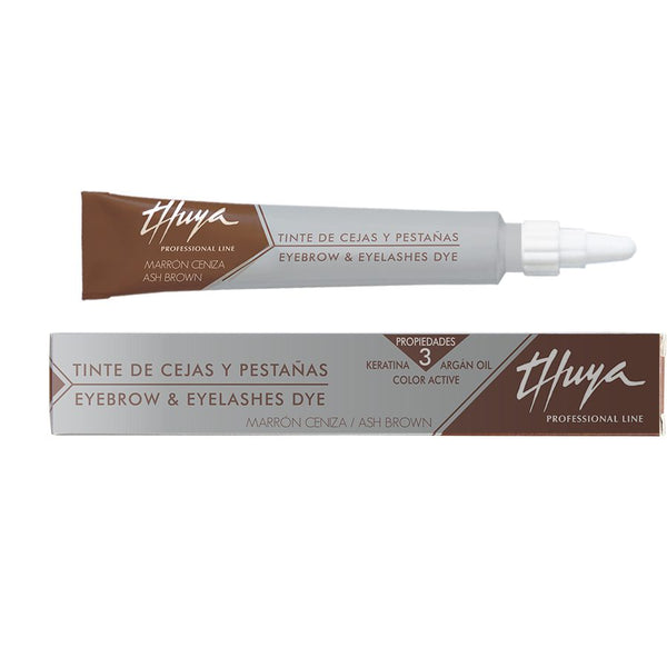 A 14ml tube of Thuya Display Lash & Brow Tint in ash brown , a professional-grade tint for long-lasting color. The tube features a sleek, modern design with a black and gold label, highlighting the rich color inside. This tint is used for brow tinting and lash tinting services to achieve a deep, bold, and natural finish. The tube is set against a clean, white background, emphasizing the high-quality and professional nature of the product.