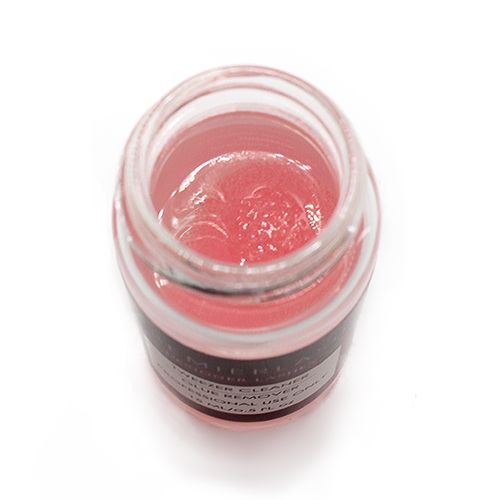 "PremierLash Tweezers Cleaner Glue Remover in a compact, practical container, ideal for removing adhesive residue from lash tools, on a red background."
