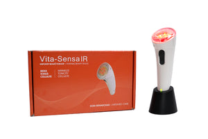 Vitali-T Vita Sensa IR facial stimulator, with a white handle and red accents, designed for infrared light therapy. The device includes 21 LED diodes, with 16 infrared (875nm) and 5 red (660nm) diodes, positioned on the device’s head. The product is displayed alongside its accessories: a transformer, adapters, base, user guide, and travel kit. The overall device is ergonomic and sleek.